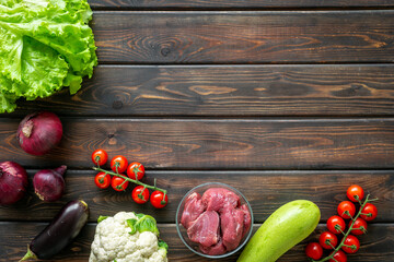 Variety of organic food. Raw beef meat and vegetables for cooking