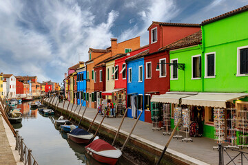 Fototapeta na wymiar Colorful houses and canal on Burano island, near Venice, Italy.