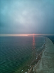 Aerial view on the foggy morning sunrise during autumn on sea scape.