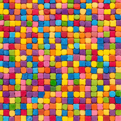 Background from small colorful dragees of candies of different shapes.