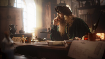 Portrait of an Old Renaissance Male Inventor Writing and Thinking about New Ideas. Dedicated Historian Taking Notes, Writing a Book about the Important and Innovative Eras in the History of Humanity - obrazy, fototapety, plakaty