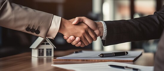 A Friendly Real Estate Transaction: Two Men Shaking Hands in Front of a House
