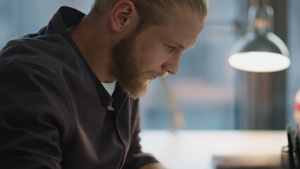 Serious man fingers texting keyboard office closeup. Freelancer working laptop