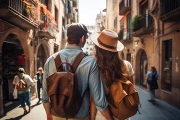 Tuinposter Rear view of a happy tourists on their trip in Europe © sirisakboakaew