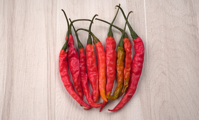Fresh long Indian green and red chillies on beautiful background. Organic Indian spices for hot and...