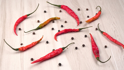 Fresh long Indian green and red chillies on beautiful background. Organic Indian spices for hot and...
