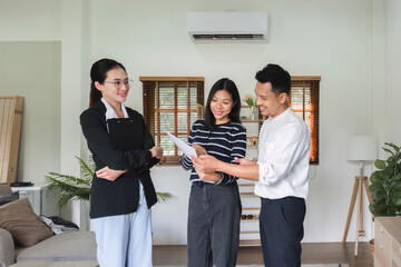 Real estate agents present and advise clients in deciding whether to sign a home sales agreement...