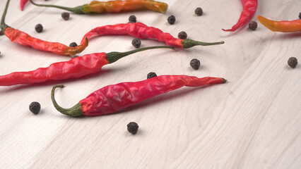 Fresh long Indian green and red chillies on beautiful background. Organic Indian spices for hot and...