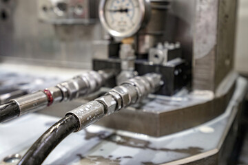 Hydraulic hoses with pressure sensor for oil flow. - obrazy, fototapety, plakaty
