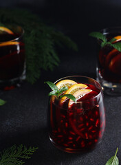 Pomegranate and orange cocktail with mint