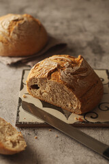 A loaf of rye bread in low key	