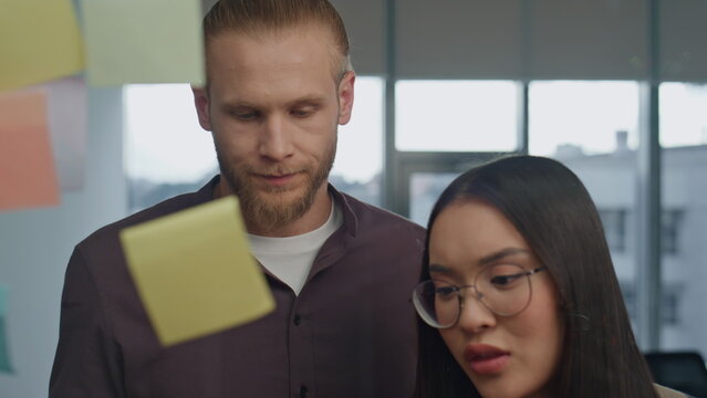 Portrait woman emotionally explaining sticker board place. Angry people arguing - Powered by Adobe