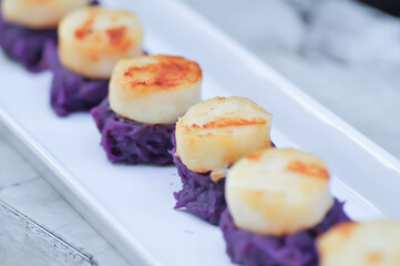 mash purple potato with scallop topping
