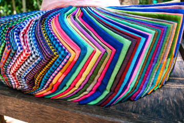 Colored Cambodian shawls for sale on a market stall in Angkor, Cambodia, Asia