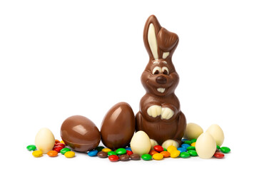 Easter chocolate bunny isolated on a white background. Chocolate eggs and other sweets. Easter celebration concept. Easter sweets on the table. Place for text. copy space.