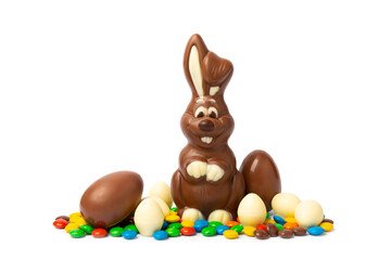 Easter chocolate bunny isolated on a white background. Chocolate eggs and other sweets. Easter celebration concept. Easter sweets on the table. Place for text. copy space.