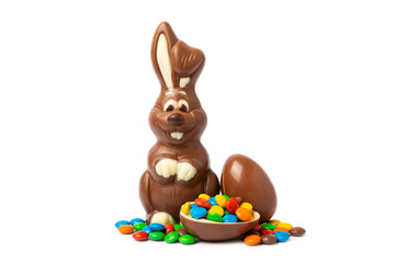 Easter chocolate bunny isolated on a white background. Chocolate eggs and other sweets. Easter celebration concept. Easter sweets on the table. Place for text. copy space.