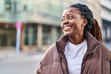 African american woman smiling confident looking to the side at street