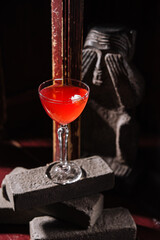 Italian cocktail with flower on gray stone