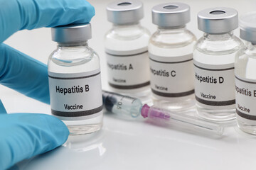 Hepatitis B vaccine in a vial, immunization and treatment of infection - obrazy, fototapety, plakaty