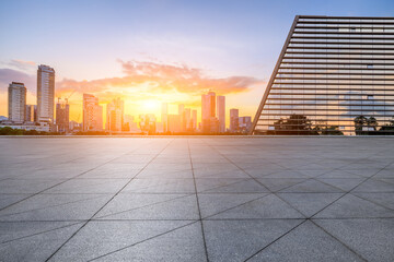 City square and skyline with modern buildings in Shenzhen at sunset, China.