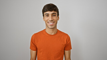 Cheerful young hispanic guy confidently standing, flaunting his attractive smile. this handsome...