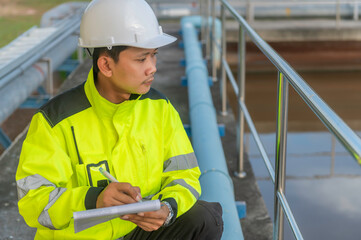 Environmental engineers work at wastewater treatment plants,Water supply engineering working at...