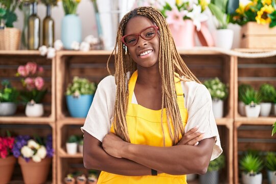 African american woman florist smiling confident standing with arms crossed gesture at florist