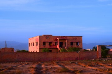 Old abandoned building. Haunted house with old and dilapidated walls. abandoned house in a barren...