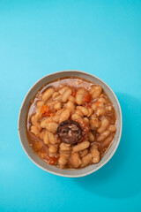 typical portuguese dish dobrada with beans in ceramic bowl