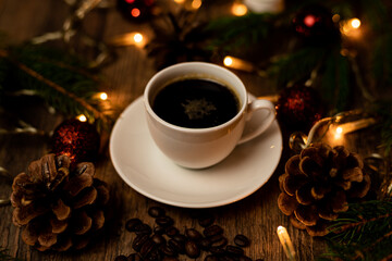Coffee break on Christmas evening. A cup of espresso coffee on the table