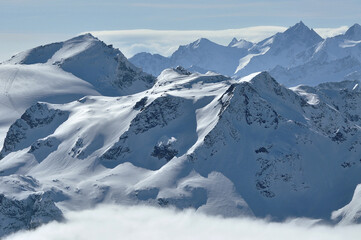 Snow covered mountain slopes in the Alps