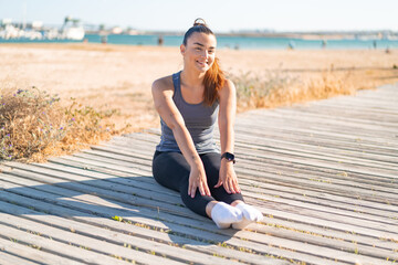 Young pretty sport woman doing yoga