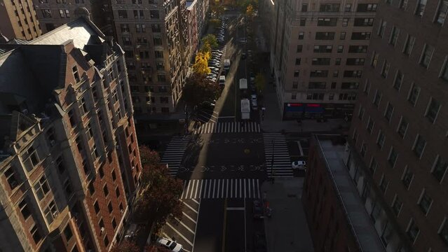 Aerial shot of city streets in Harlem, New York on an autumn morning.
