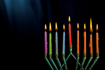 Fototapeta na wymiar With Hanukkiah menorah burning candles Hanukkah is traditional religious symbol of Jewish holiday Hanukkah