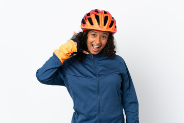 Teenager cyclist woman isolated on white background making phone gesture. Call me back sign