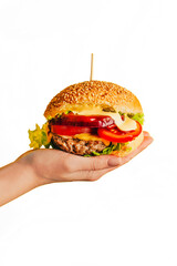 close-up of a hamburger in a woman's hand on a white background