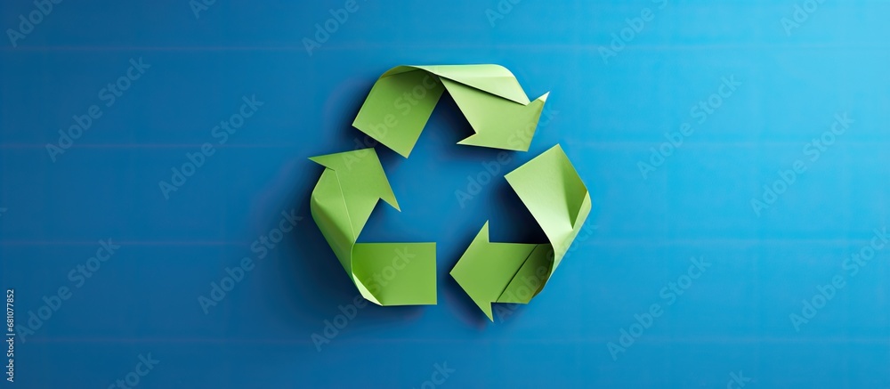 Poster recycled symbol with various materials on blue background promoting reuse and reduction copy space i
