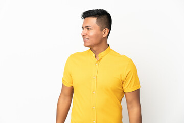 Fototapeta premium Young Ecuadorian man isolated on white background looking side