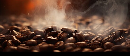 Roasting coffee beans with smoky focus and blur Copy space image Place for adding text or design - obrazy, fototapety, plakaty