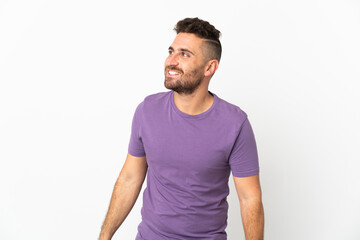 Obraz premium Caucasian man isolated on white background looking to the side and smiling