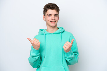Fototapeta premium Teenager Russian man isolated on white background with thumbs up gesture and smiling