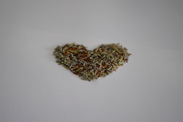 Tea herbs rooibos and lavender in heart shape.