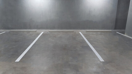 Underground vacant parking lot in building basement, white color painted marking line on exposed...