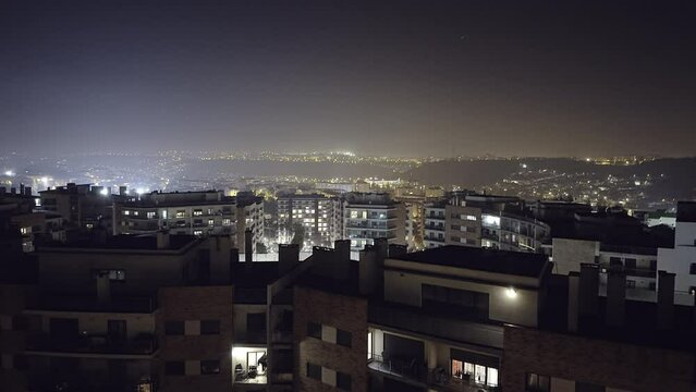 Night view of modern urbanization in Lisbon Portugal. Odivelas, Cruzeiro hills.