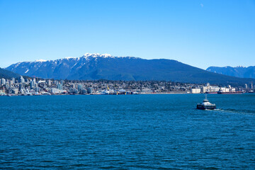 various recognizable places and attractions of Vancouver in Canada city center parks places for people to walk roads in spring good weather clean downtown blue sky huge buildings. skyscrapers 