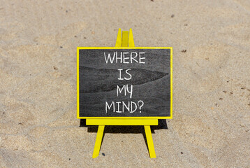 Where is my mind symbol. Concept words Where is my mind on beautiful black chalk blackboard. Beautiful sand beach background. Business, motivational and where is my mind concept. Copy space.