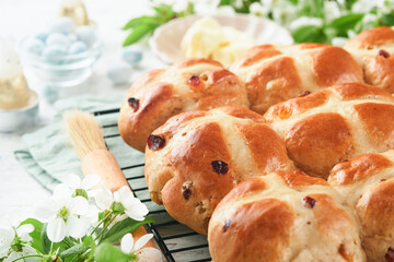 Easter Hot cross buns. Traditional Easter treats cross buns with raisins, butter, chocolate candy...