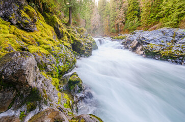 Majestic mountain river in slow motion with mountain background in Vancouver, Canada. - obrazy, fototapety, plakaty
