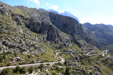 Fototapeta na wymiar serpentine road between mountains landscape
